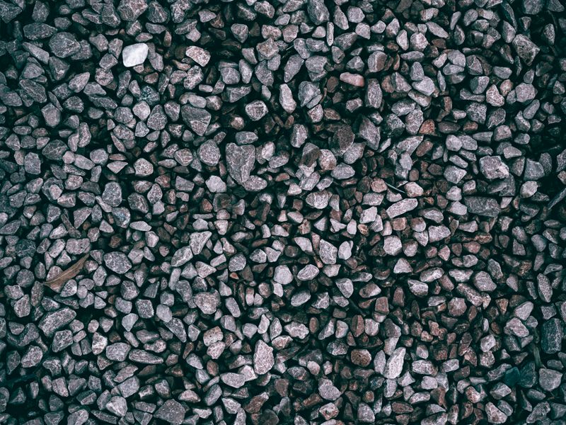 Newly installed gravel driveway with proper grading
